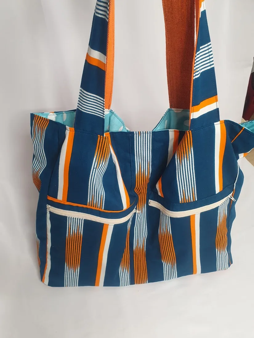 Petite pochette zippée en wax bleu et jaune cousue main